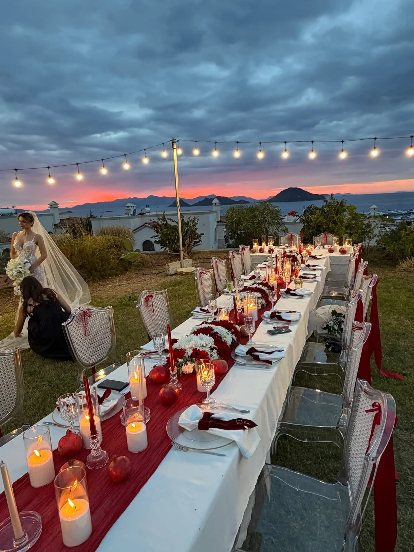 Intimate villa wedding dinner in Bodrum, a long candlelit table at sunset