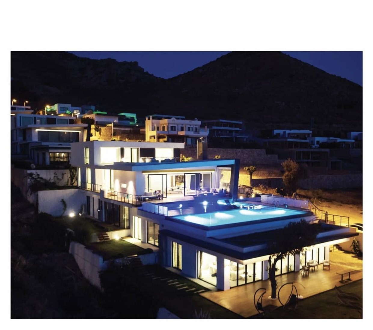 Marinhill villa at night with illuminated pool and architecture in Bodrum