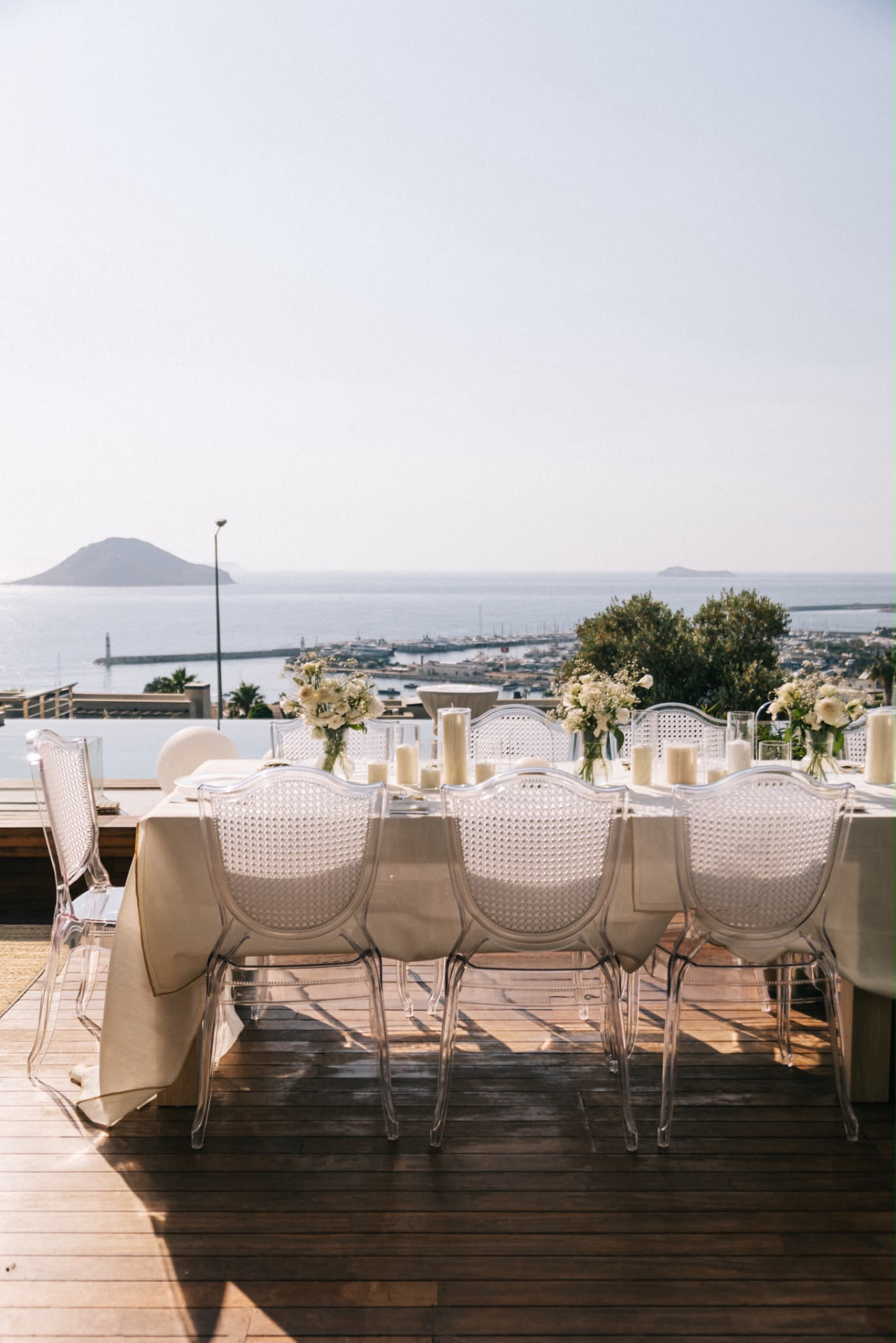 Elegant outdoor dining table overlooking the Bodrum sea and marina for a creator and brand retreat